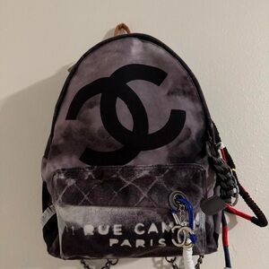 CHANEL Gray and Black Backpack with Orange Accent